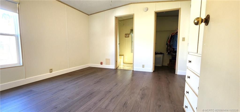 1601 Highway 441, Unit 3 Okeechobee, FL 34974 - Photo 11 of 17 a view of a hallway with wooden floor