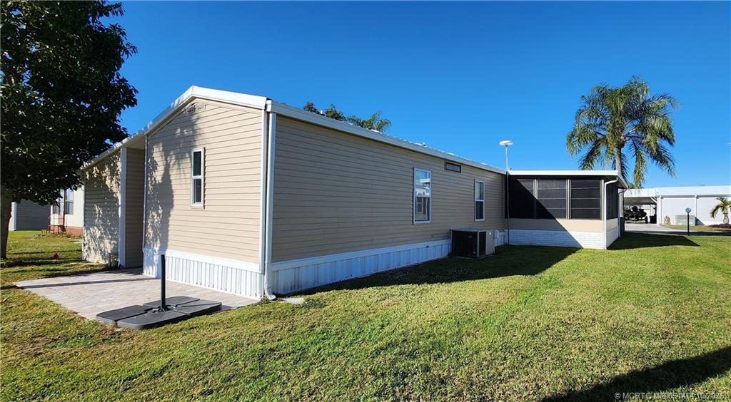 1601 Highway 441, Unit 3 Okeechobee, FL 34974 - Photo 3 of 17 a front view of house with yard and trees