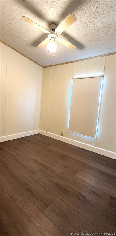 1601 Highway 441, Unit 3 Okeechobee, FL 34974 - Photo 10 of 17 an empty room with wooden floor and windows
