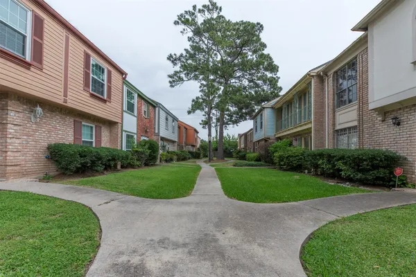 a view of a building with a yard