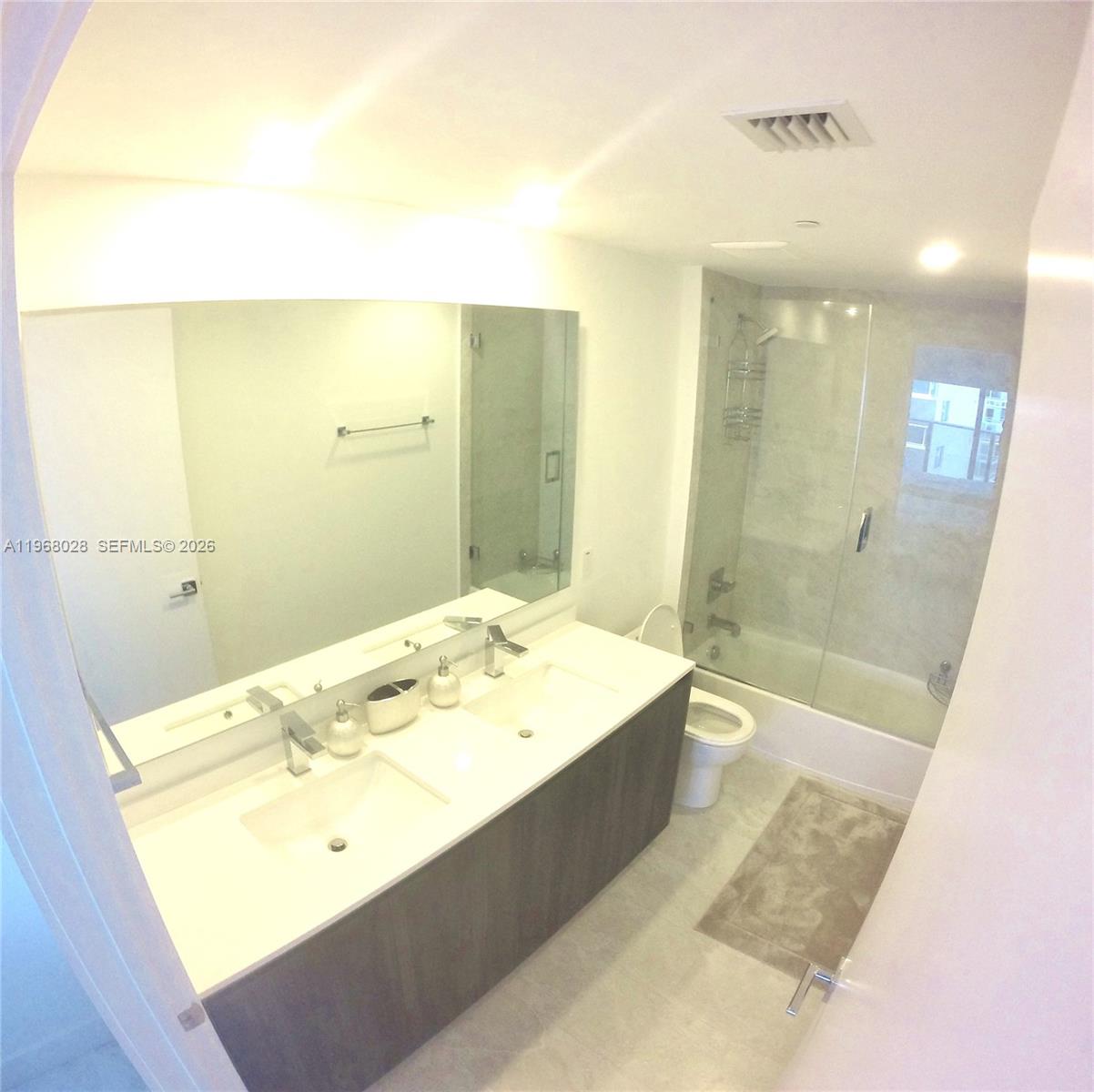 488 Northeast 18th Street, Unit 2001 Miami, FL 33132 - Photo 11 of 26 a bathroom with a bathtub and shower