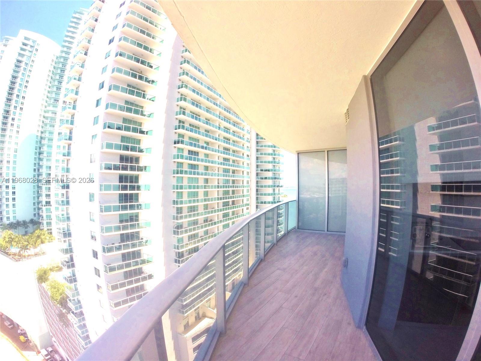 488 Northeast 18th Street, Unit 2001 Miami, FL 33132 - Photo 14 of 26 a view of balcony with wooden floor