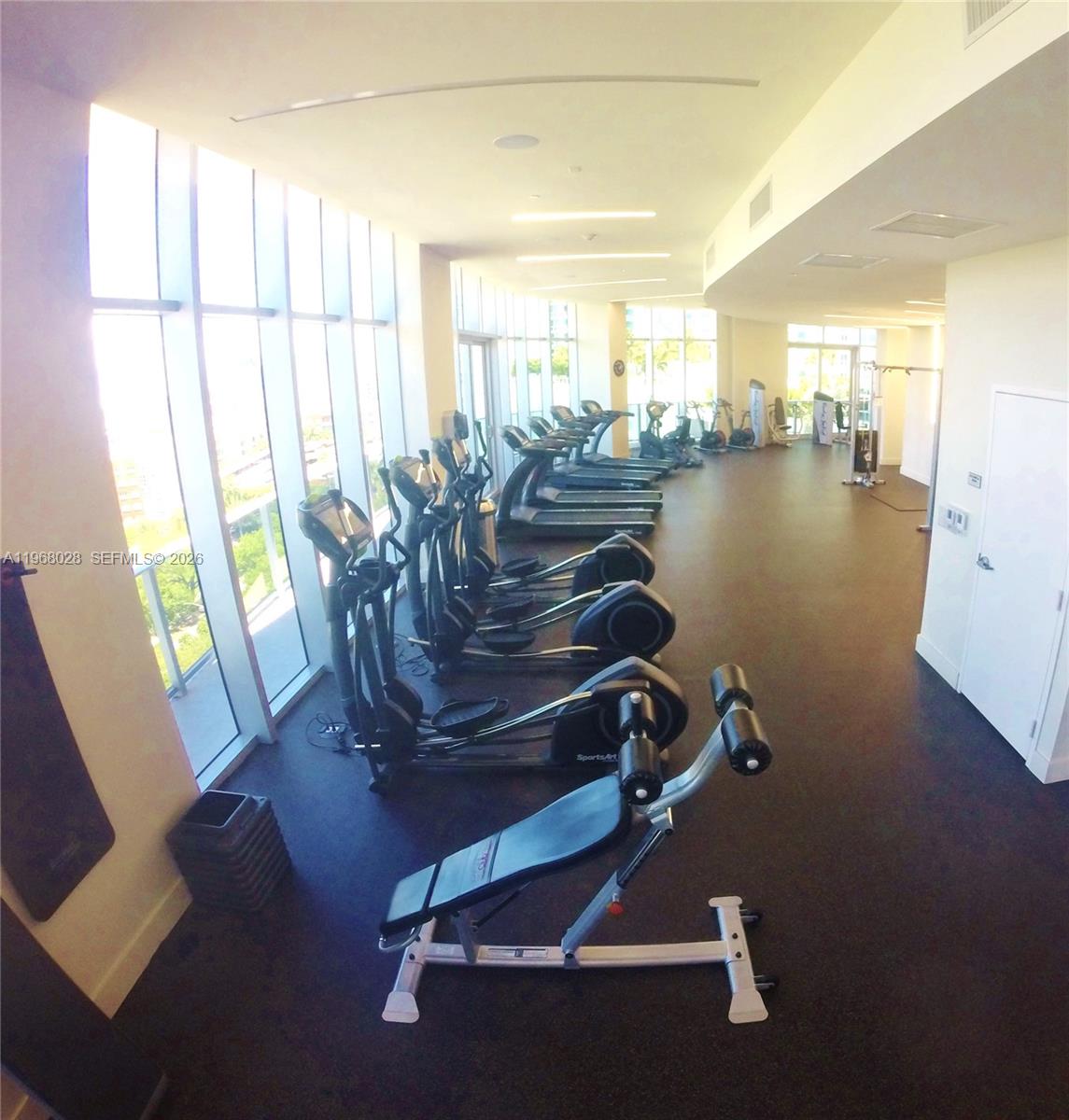 488 Northeast 18th Street, Unit 2001 Miami, FL 33132 - Photo 23 of 26 a room with gym equipment