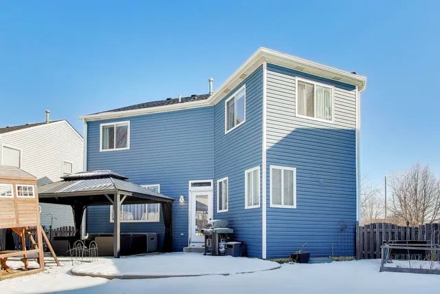 a front view of a house with garage