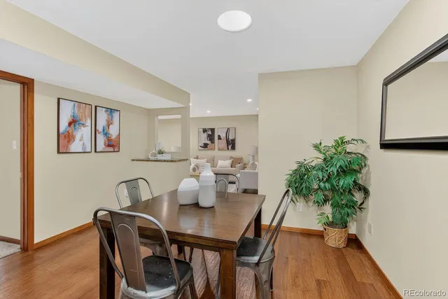 a view of a dining room with furniture and wooden floor