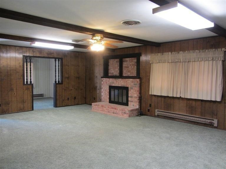 1412 Ave L Ralls, TX 79357 - Photo 8 of 10 a view of an empty room with a fireplace