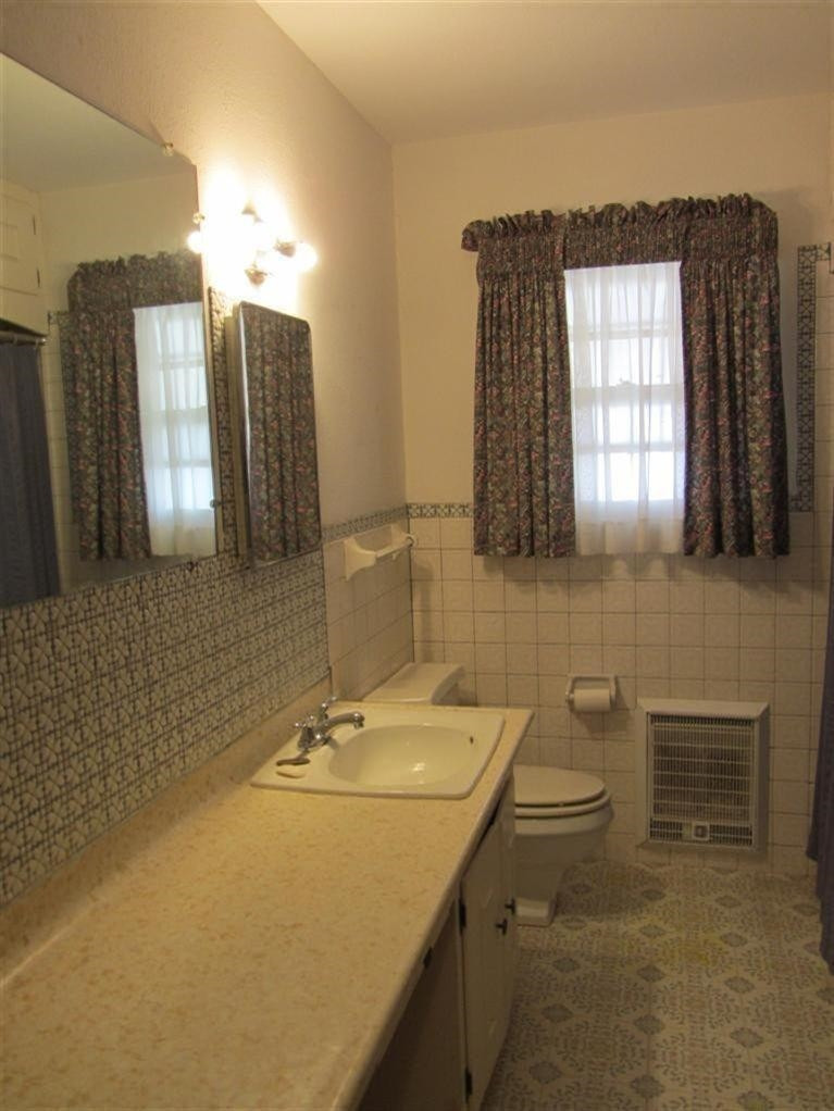 1412 Ave L Ralls, TX 79357 - Photo 10 of 10 a bathroom with a sink double vanity and mirror