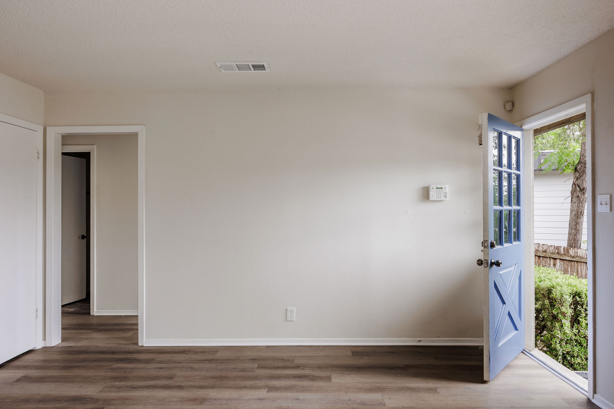 2012 Cody Court Austin, TX 78704 - Photo 24 of 40 Natural light streams into this welcoming entryway, highlighting the durable wood-look flooring.