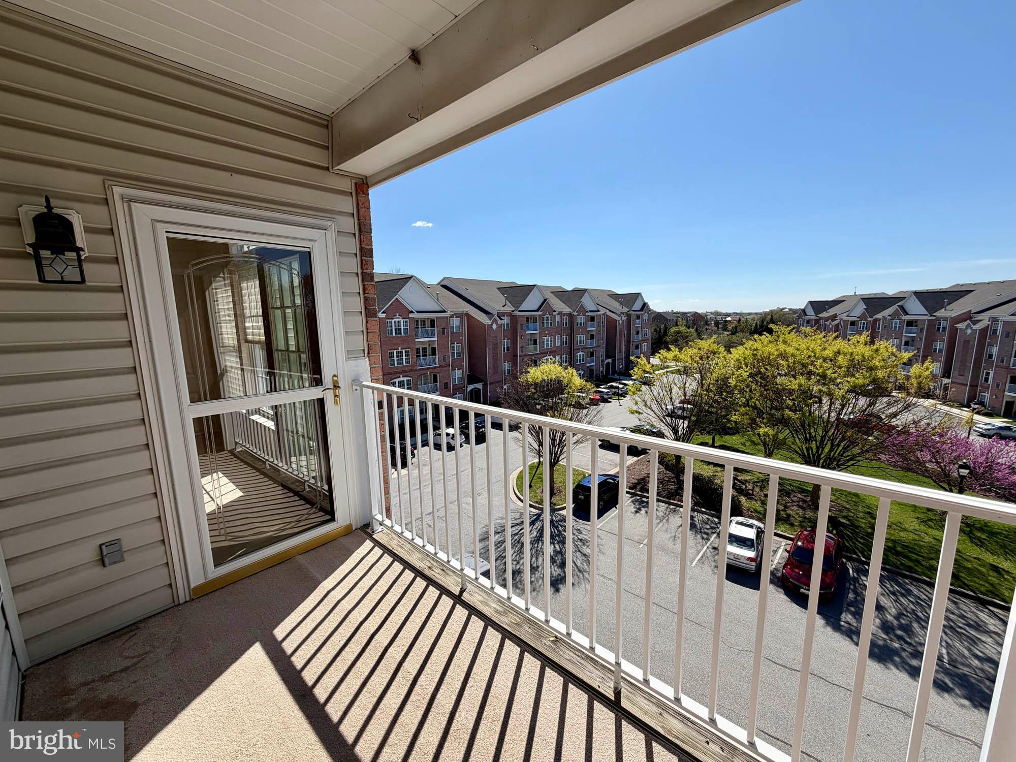 4501 Talcott Terrace, Unit 4501P Perry Hall, MD 21128 - Photo 12 of 21 a view of a balcony with wooden floor