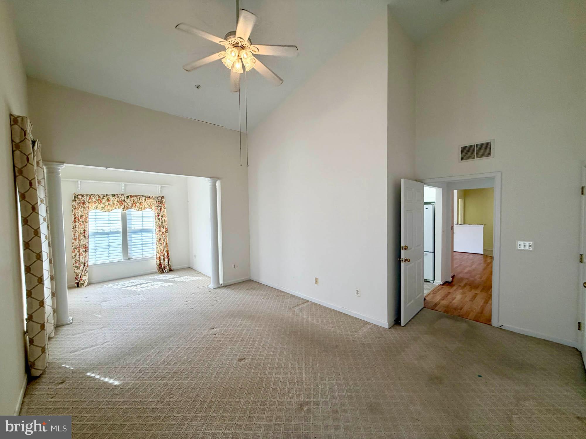 4501 Talcott Terrace, Unit 4501P Perry Hall, MD 21128 - Photo 14 of 21 a view of a big room with chandelier fan and windows