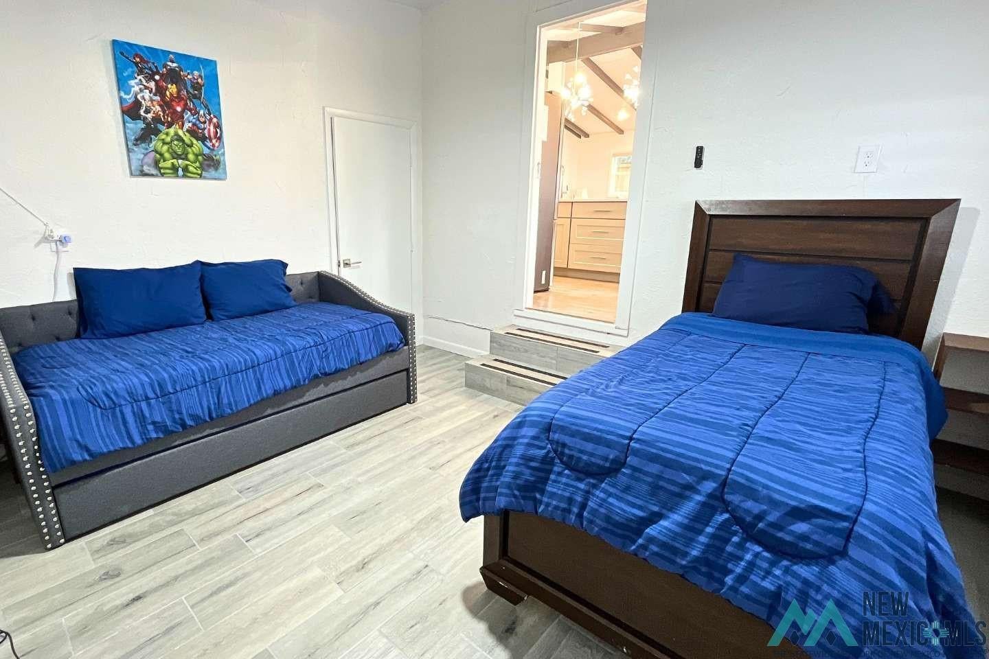 241 Junction Road Ruidoso, NM 88345 - Photo 29 of 44 Bedroom featuring wood finished floors and baseboards