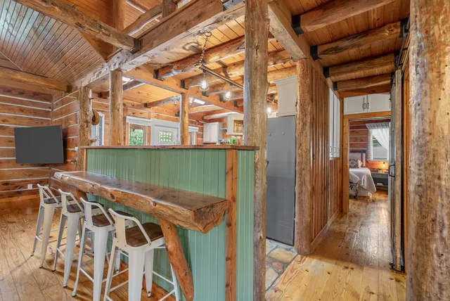 a view of a porch with furniture and front door