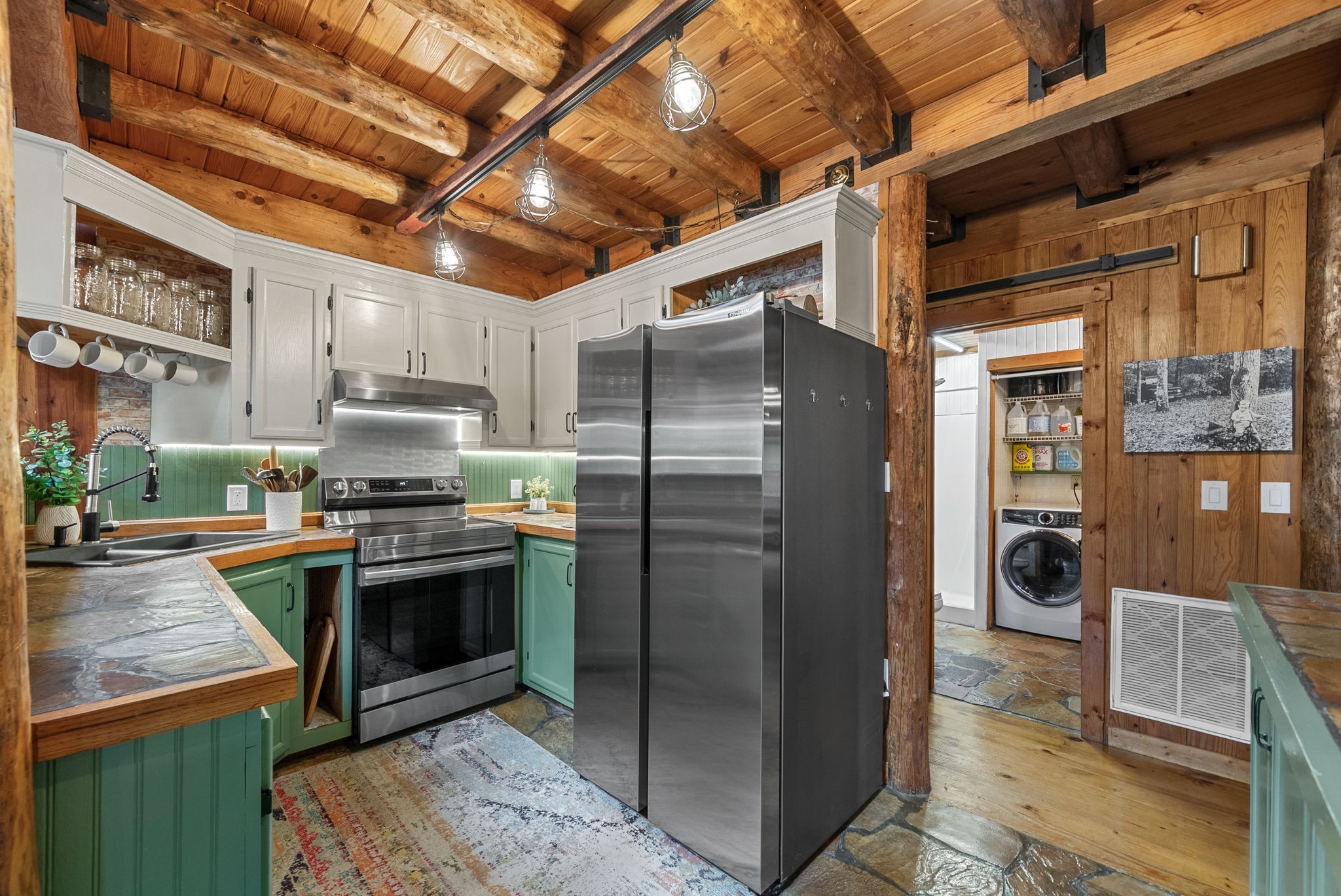 1205 Shakerag Road Hanson, KY 42413 - Photo 14 of 50 a kitchen with stainless steel appliances granite countertop a refrigerator a stove and a sink with wooden floors