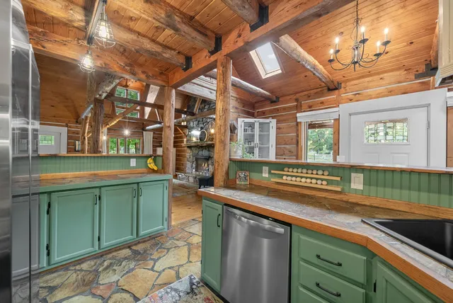 a kitchen with lots of counter space and windows