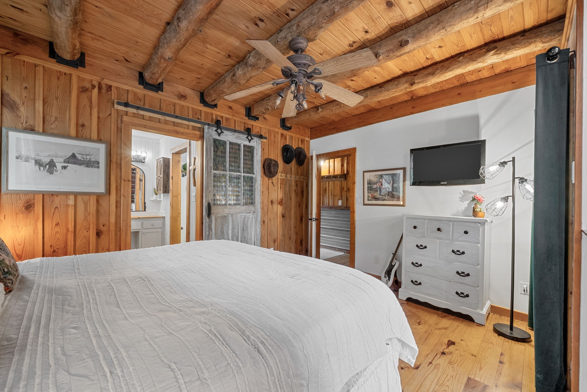 1205 Shakerag Road Hanson, KY 42413 - Photo 17 of 50 a spacious bedroom with a bed and a flat tv screen on dresser