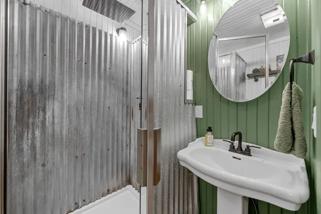 a bathroom with a sink and a mirror