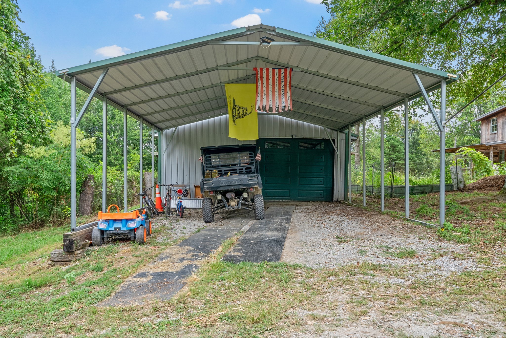 1205 Shakerag Road Hanson, KY 42413 - Photo 43 of 50 a view of patio with chairs and table under an umbrella