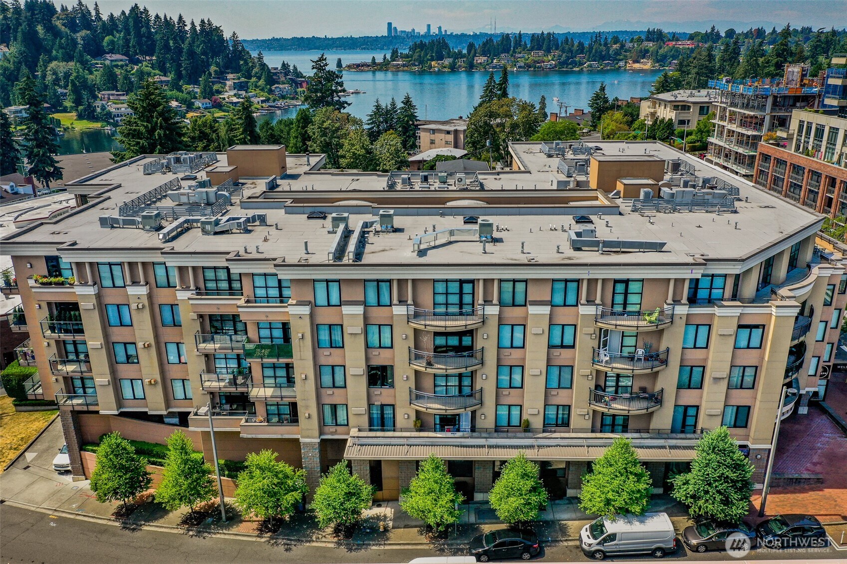10047 Main Street, Unit 206 Bellevue, WA 98004 - Photo 1 of 1 a large building with a clock tower in front of it