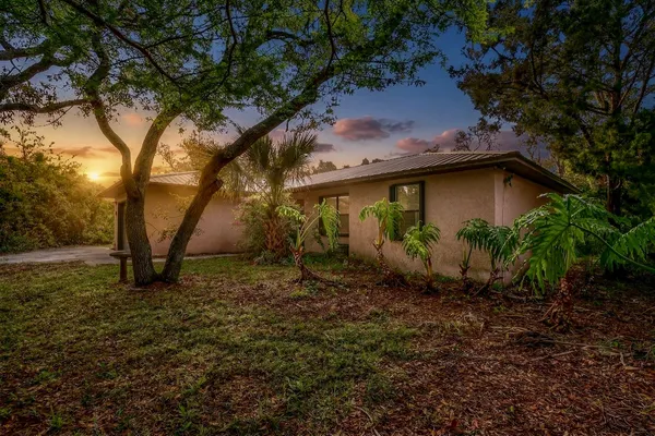a backyard of a house with lots of green space