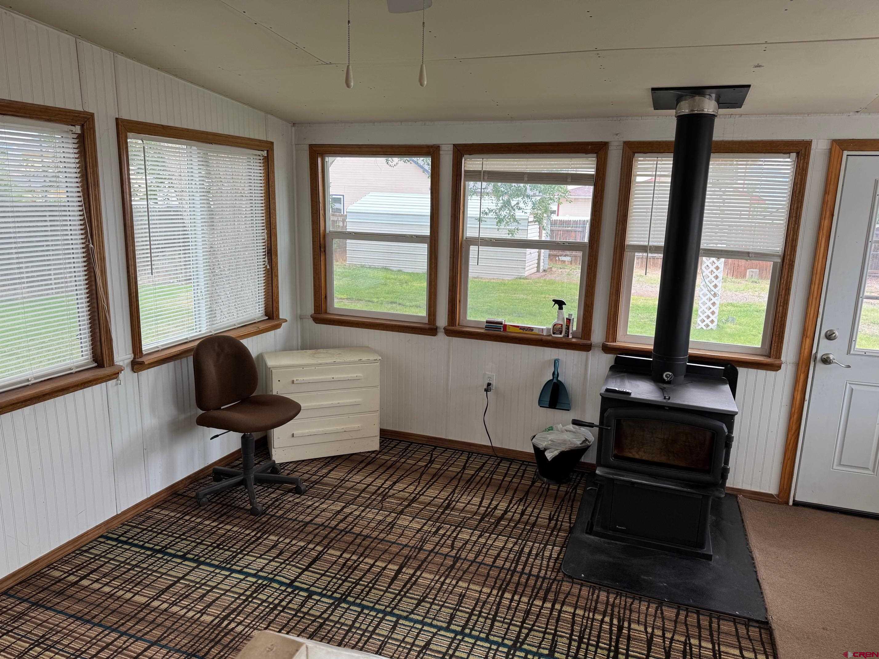 425 West 7th Street Cortez, CO 81321 - Photo 20 of 22 a living room with furniture and a window