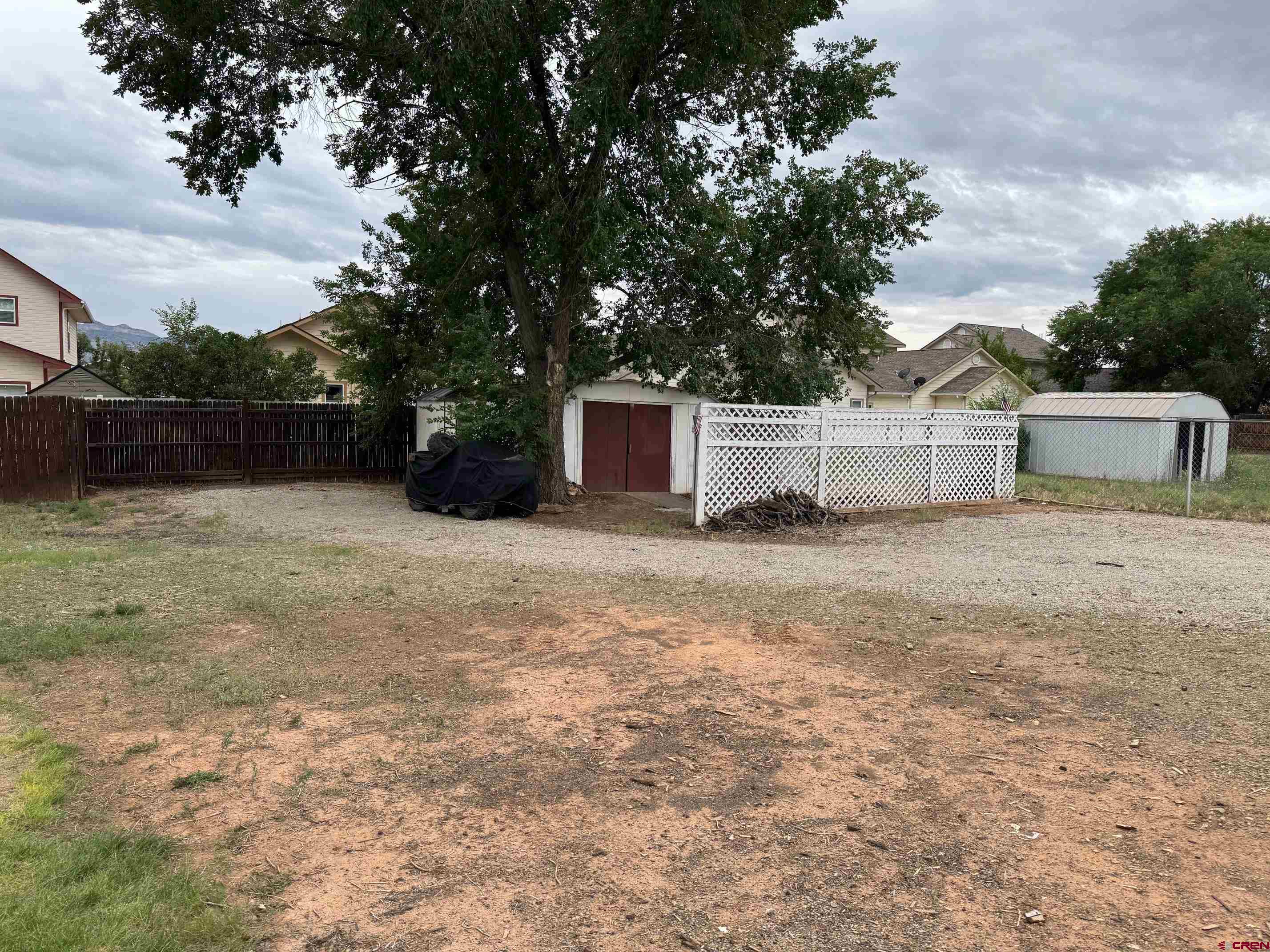 425 West 7th Street Cortez, CO 81321 - Photo 7 of 22 a backyard of a house with lots of green space