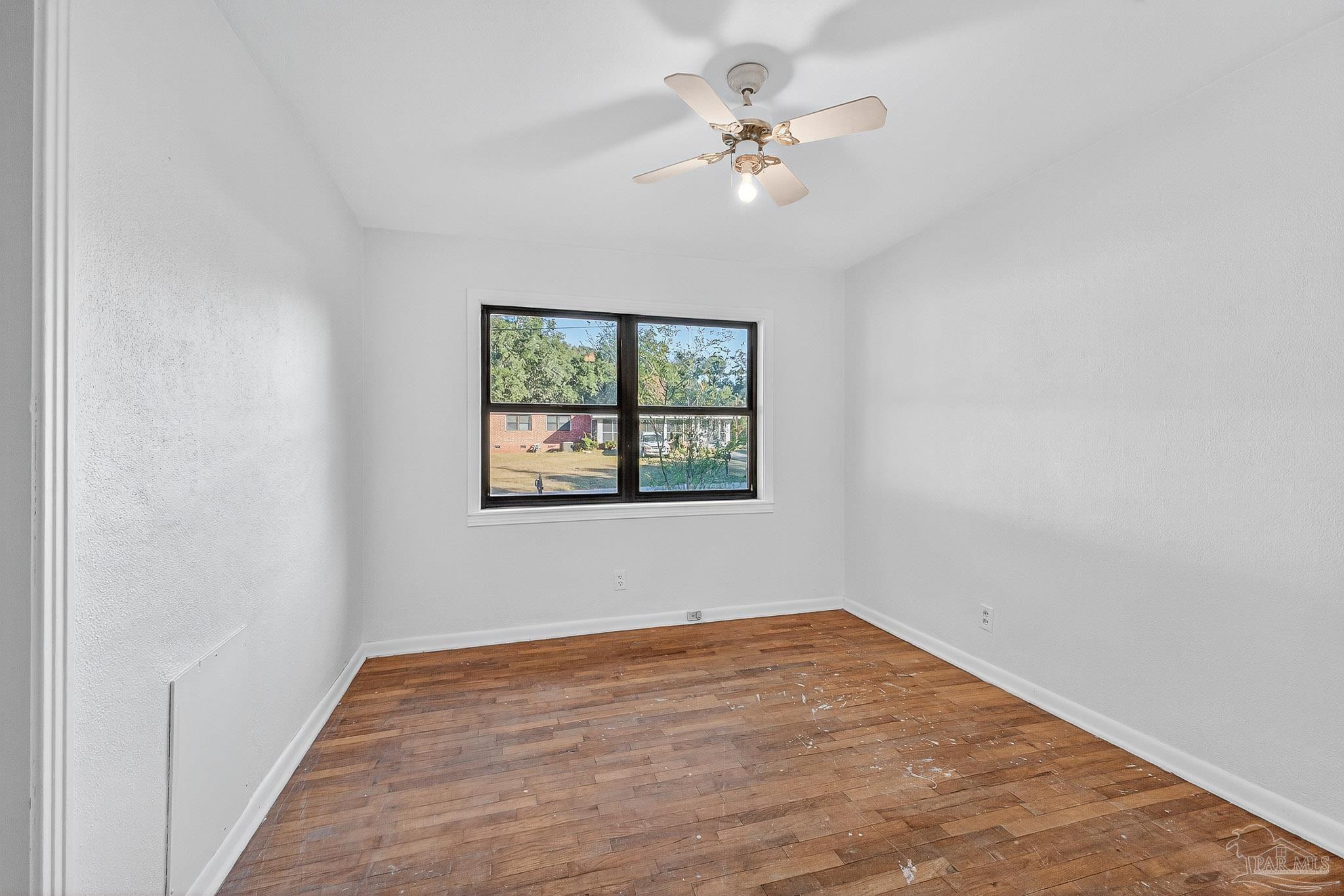 6571 Cedar Street Milton, FL 32570 - Photo 19 of 47 an empty room with a window