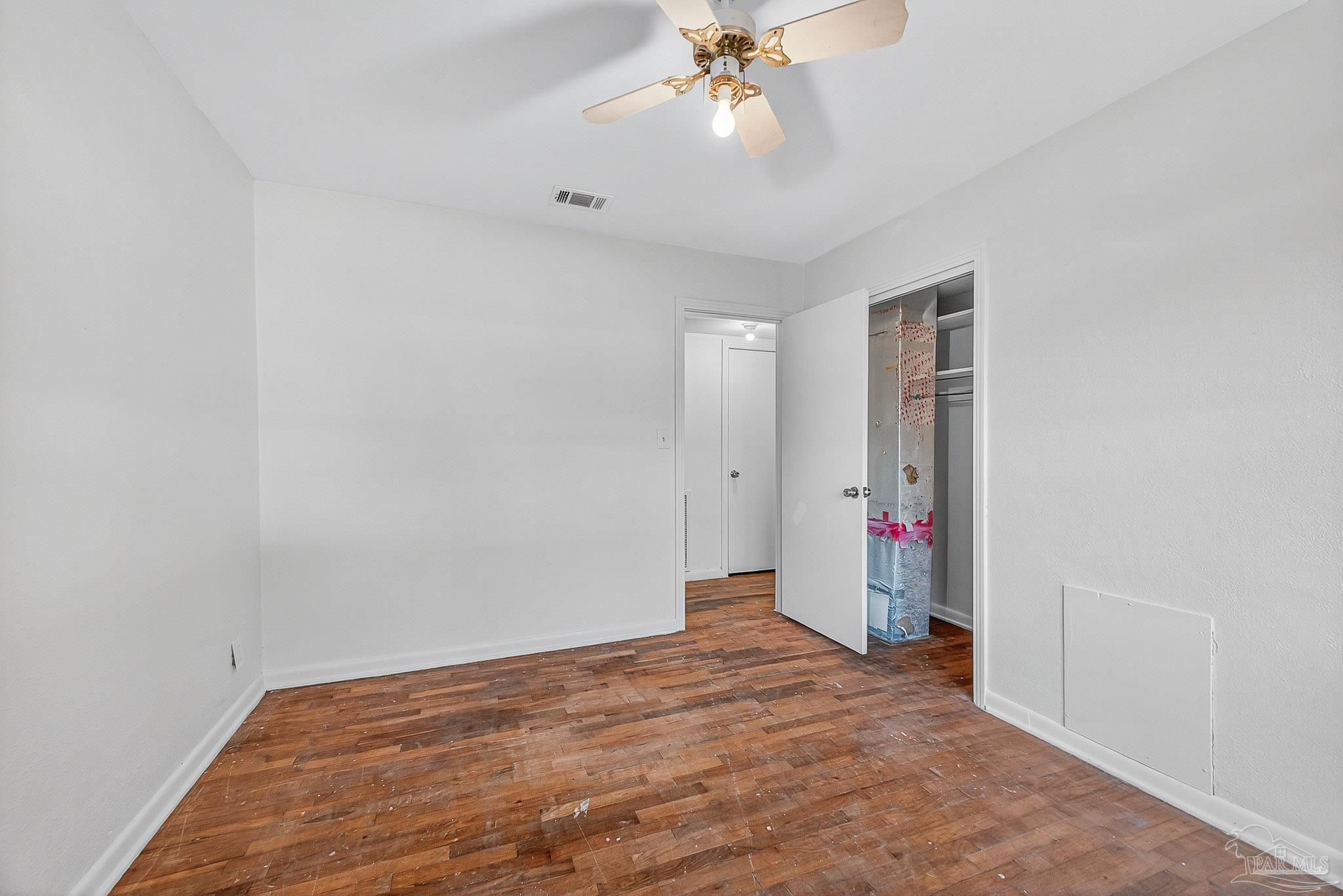 6571 Cedar Street Milton, FL 32570 - Photo 21 of 47 wooden floor in an empty room