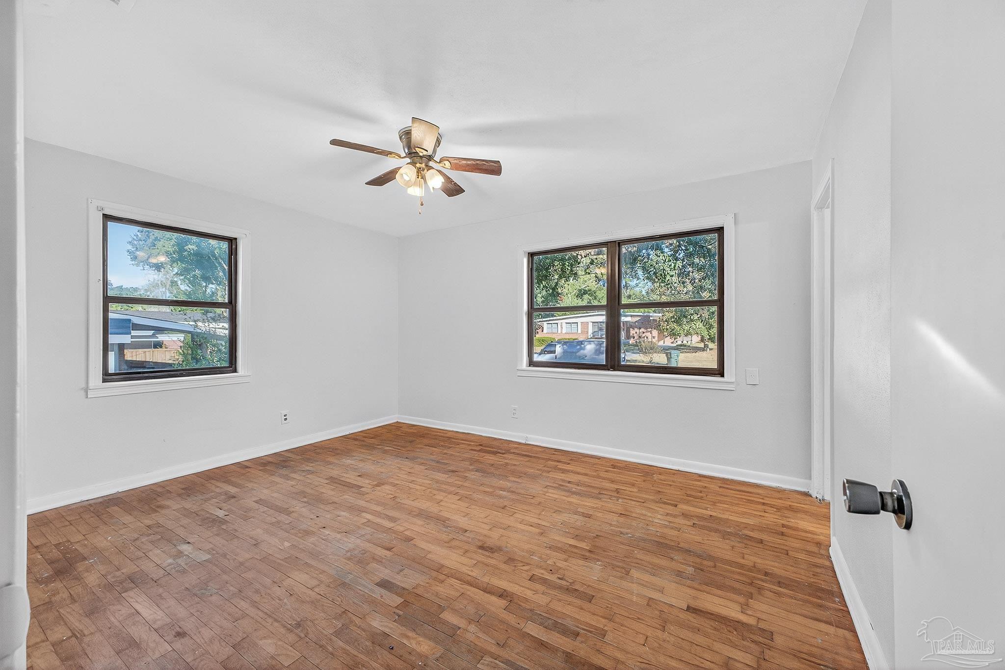 6571 Cedar Street Milton, FL 32570 - Photo 25 of 47 a view of empty room with wooden floor and fan