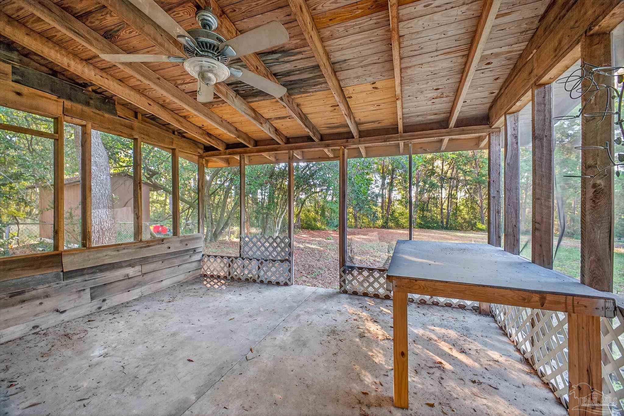 6571 Cedar Street Milton, FL 32570 - Photo 44 of 47 a view of a porch with furniture and wooden floor