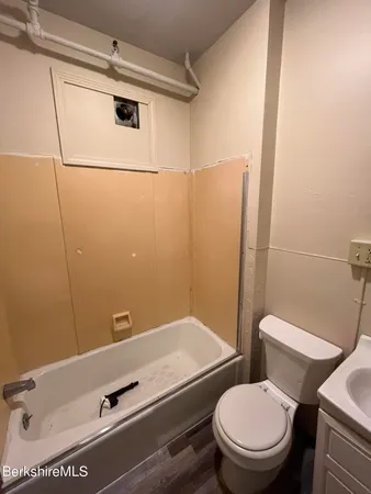 a bathroom with a toilet and a sink