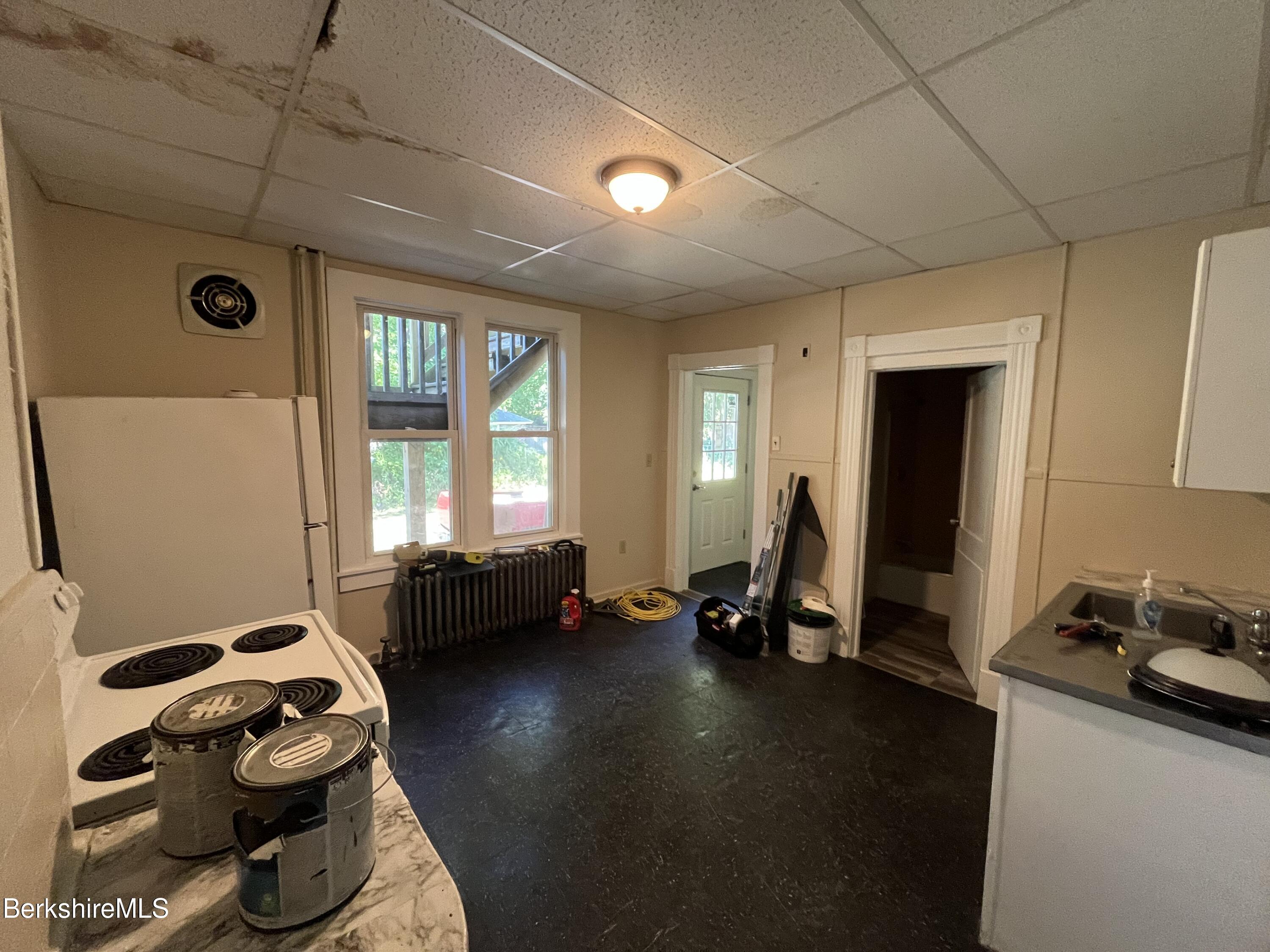21 Blackinton Street, Unit 1 North Adams, MA 01247 - Photo 9 of 13 a bedroom with furniture and a window