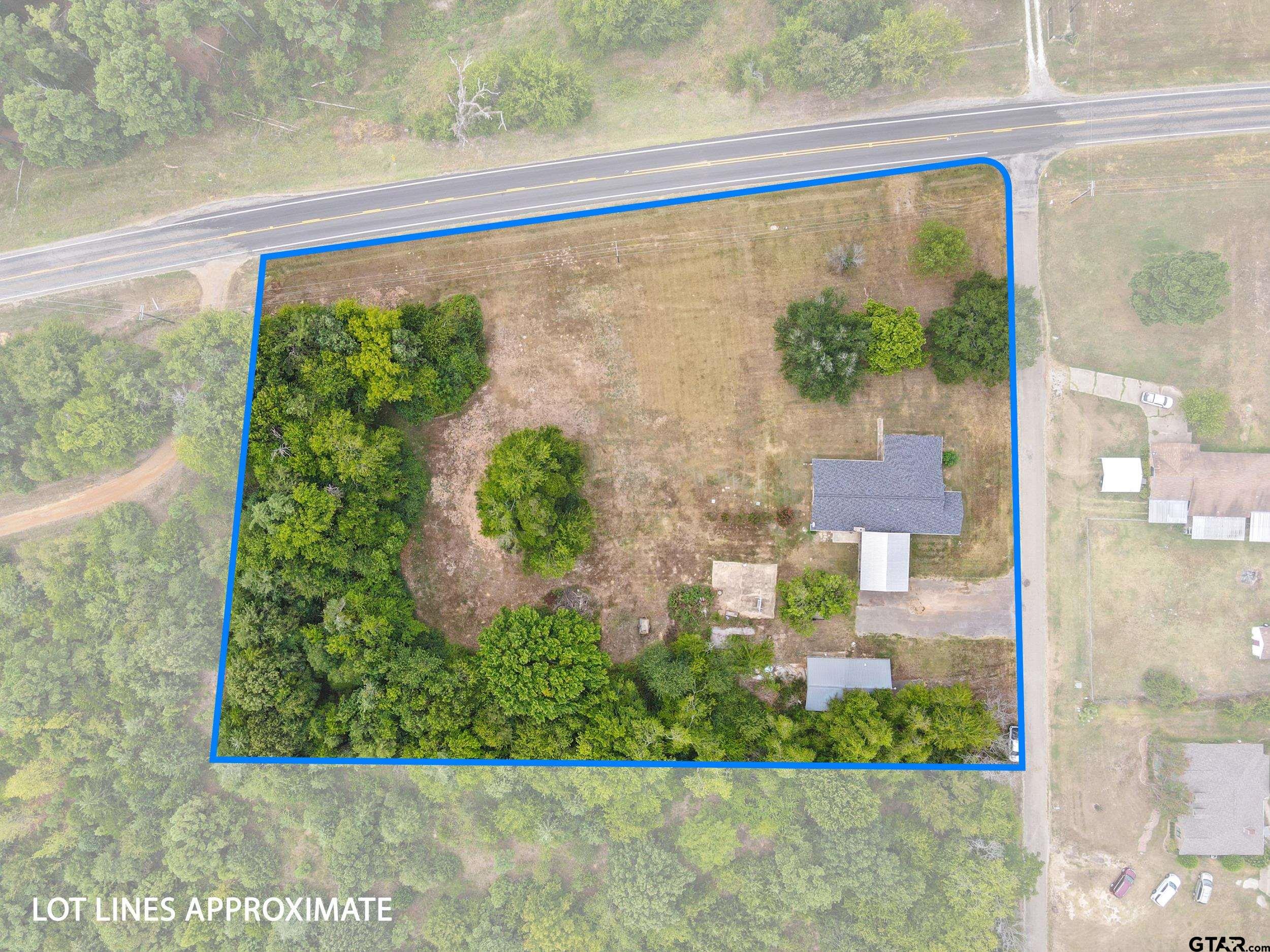 38 Quail Valley Road Mount Vernon, TX 75457 - Photo 11 of 46 a front view of a house with garden