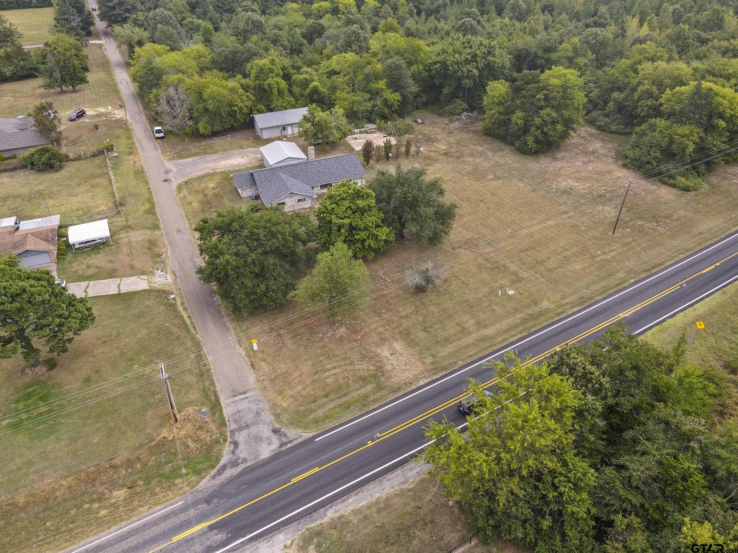 38 Quail Valley Road Mount Vernon, TX 75457 - Photo 12 of 46 a view of a backyard with plants