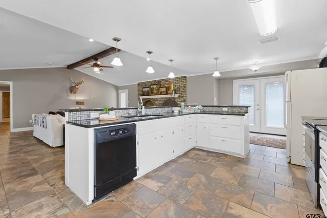 a kitchen with a stove cabinets and counter space