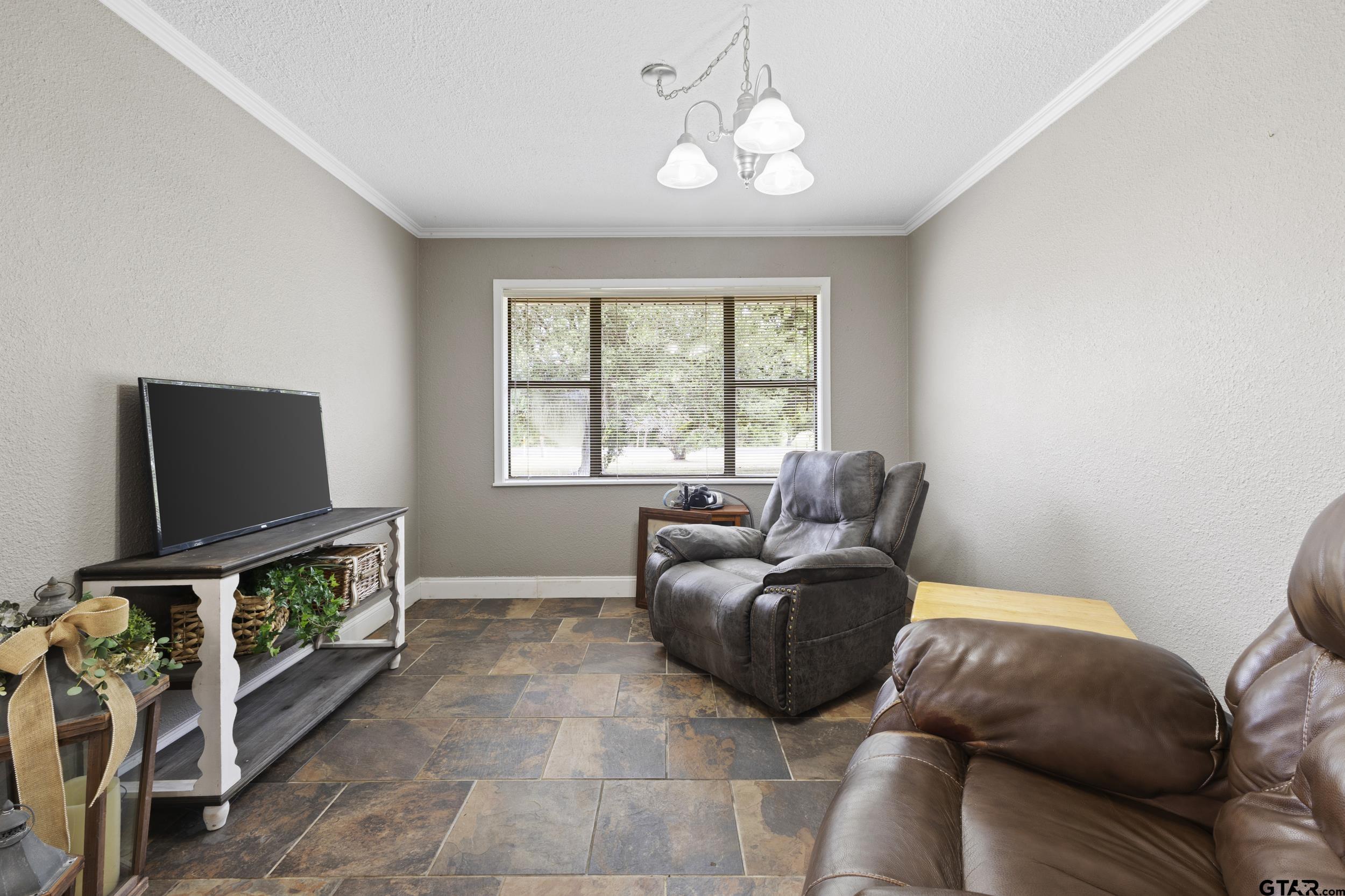 38 Quail Valley Road Mount Vernon, TX 75457 - Photo 22 of 46 a living room with furniture and a flat screen tv