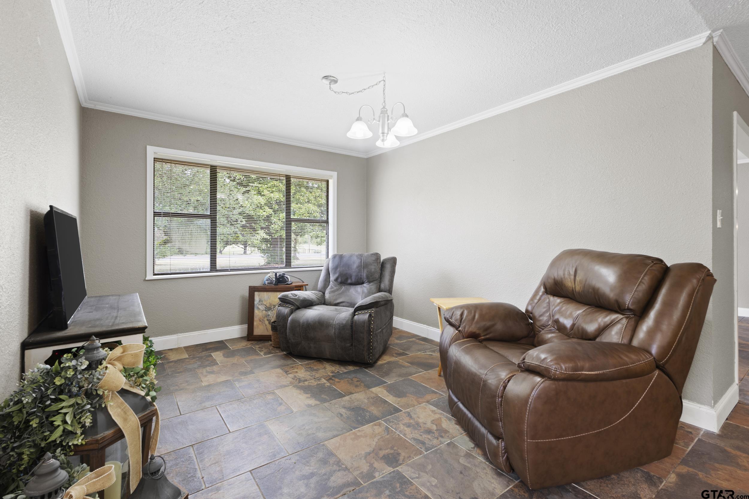 38 Quail Valley Road Mount Vernon, TX 75457 - Photo 23 of 46 a living room with furniture and a flat screen tv