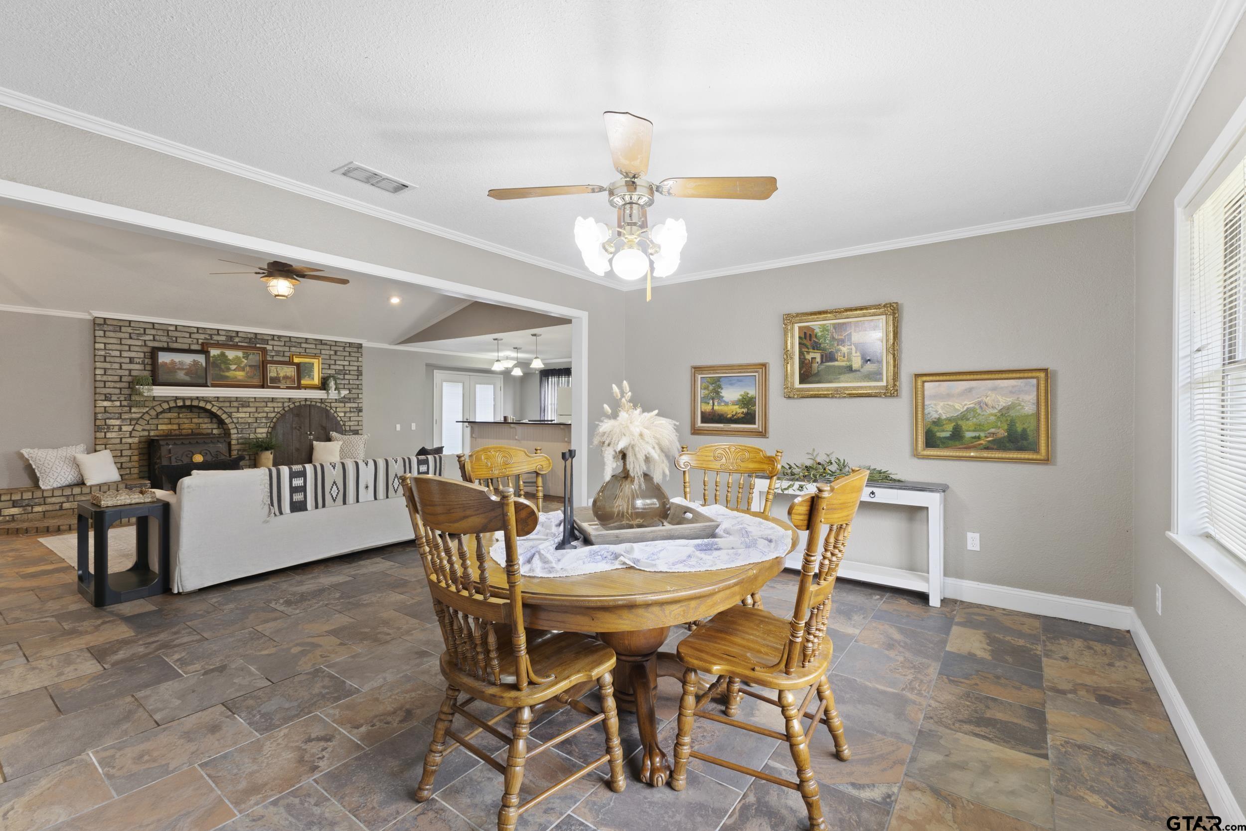 38 Quail Valley Road Mount Vernon, TX 75457 - Photo 24 of 46 a view of a dining room with furniture and chandelier