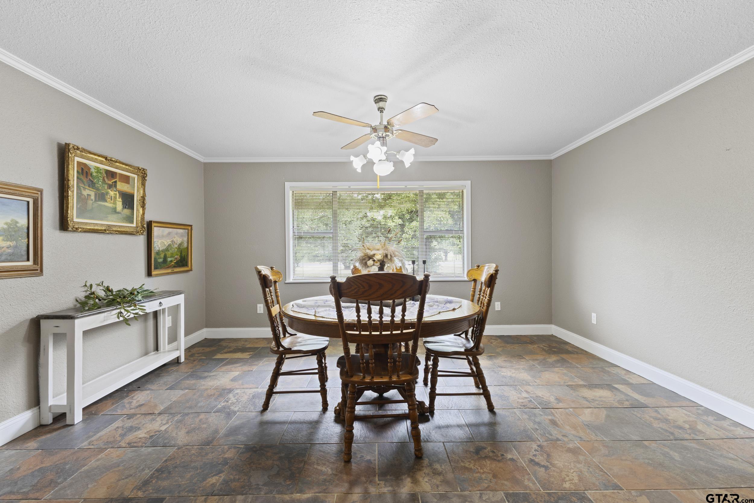 38 Quail Valley Road Mount Vernon, TX 75457 - Photo 25 of 46 a view of a dining room with furniture a chandelier and wooden floor