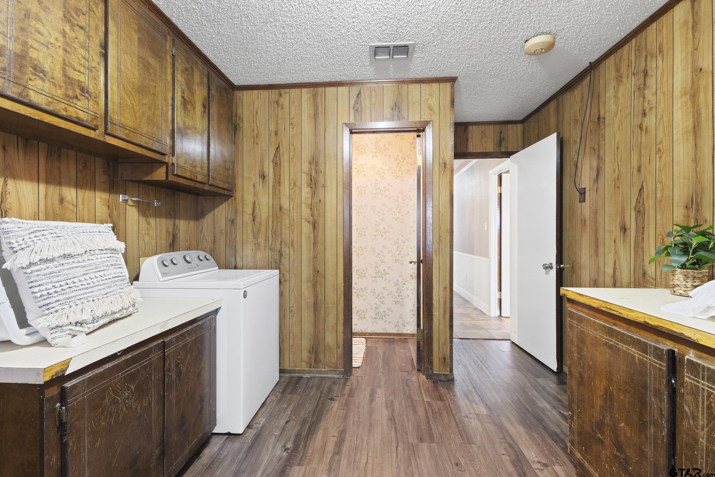 38 Quail Valley Road Mount Vernon, TX 75457 - Photo 29 of 46 a kitchen with a refrigerator a sink and wooden floor