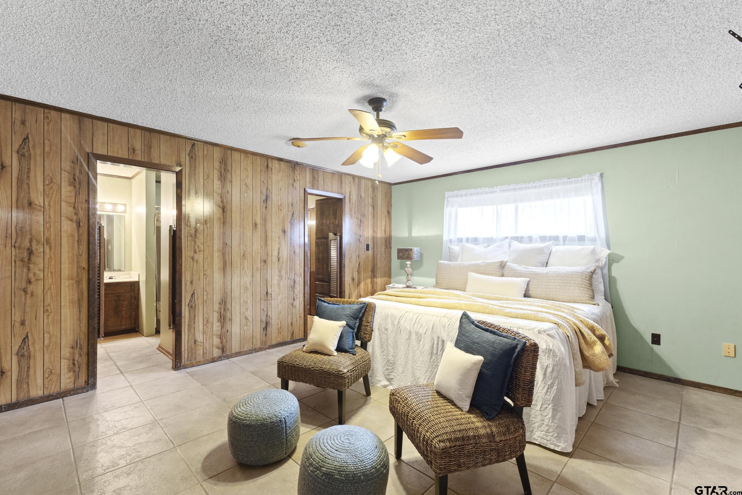 38 Quail Valley Road Mount Vernon, TX 75457 - Photo 30 of 46 a bed room with bed and a chair