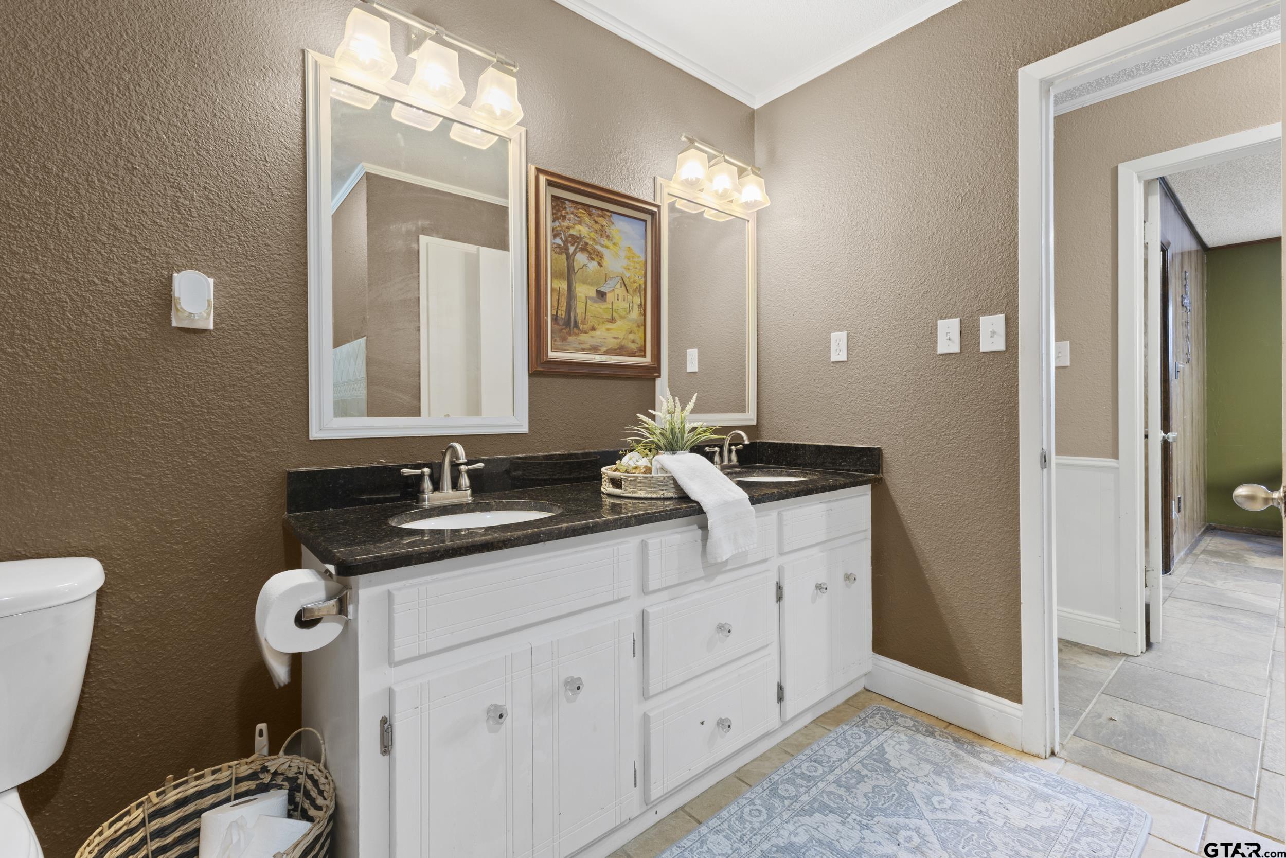 38 Quail Valley Road Mount Vernon, TX 75457 - Photo 36 of 46 a bathroom with a sink and a mirror