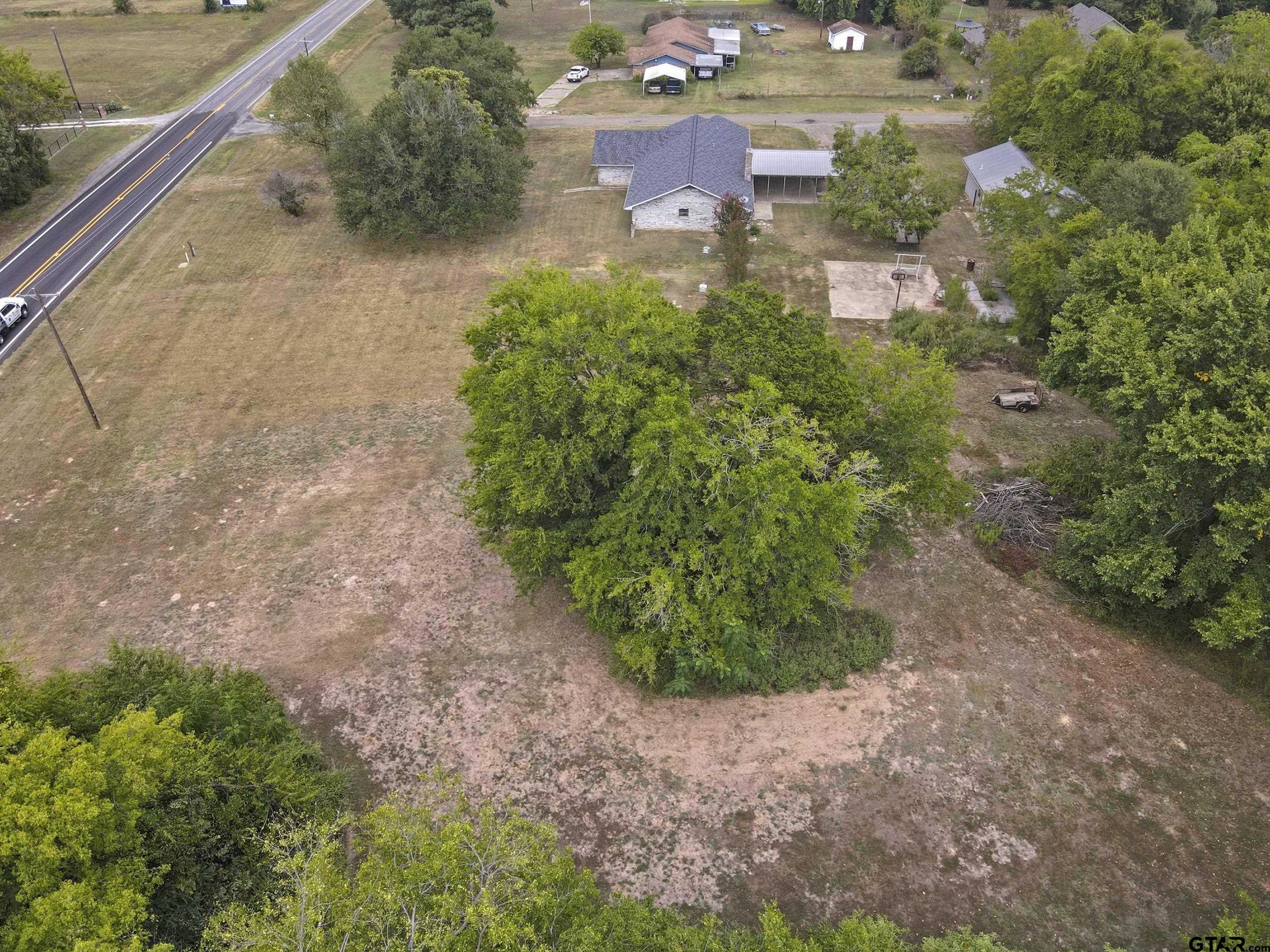 38 Quail Valley Road Mount Vernon, TX 75457 - Photo 41 of 46 a view of a garden with a building