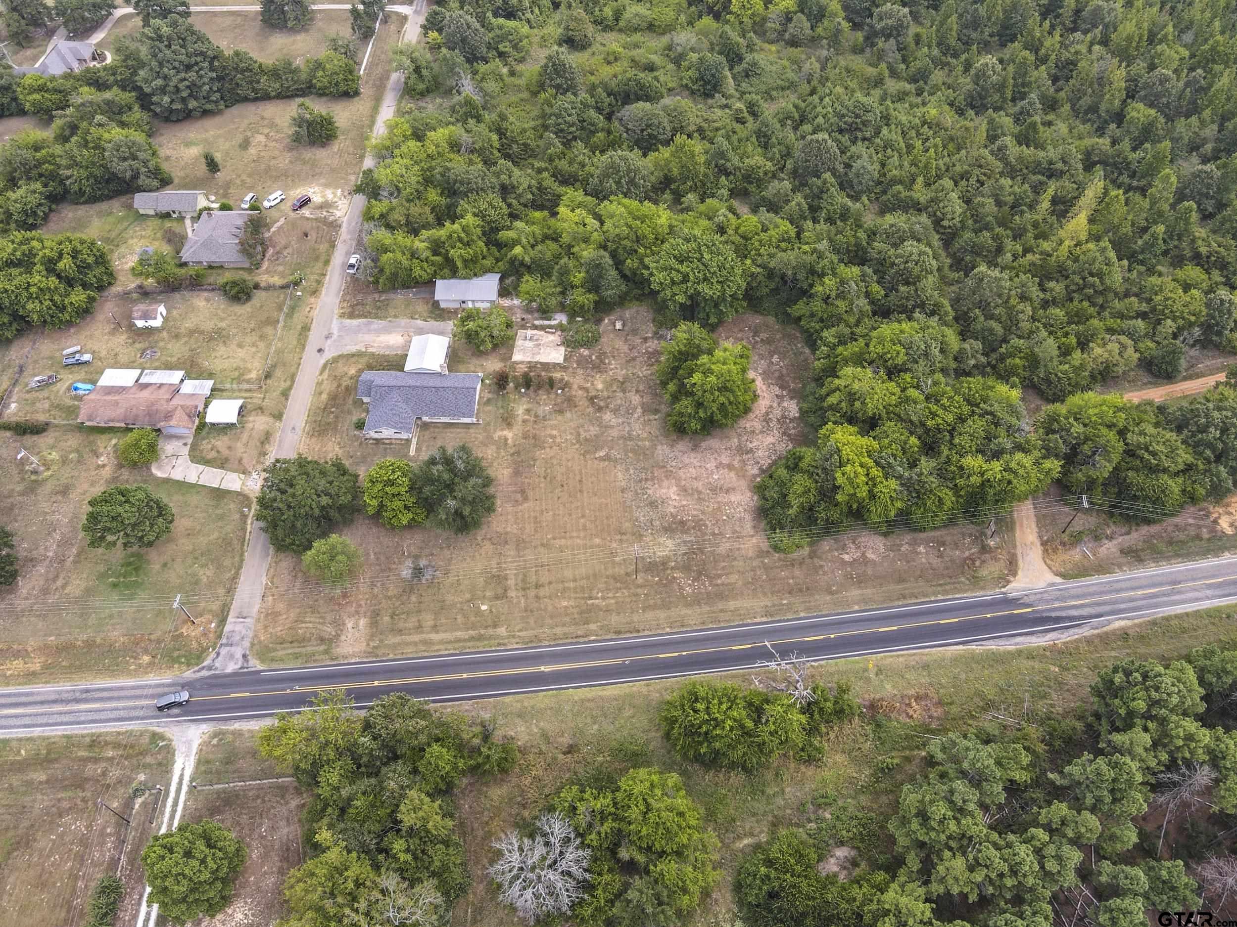38 Quail Valley Road Mount Vernon, TX 75457 - Photo 43 of 46 an aerial view of a house with a yard basket ball court and outdoor seating