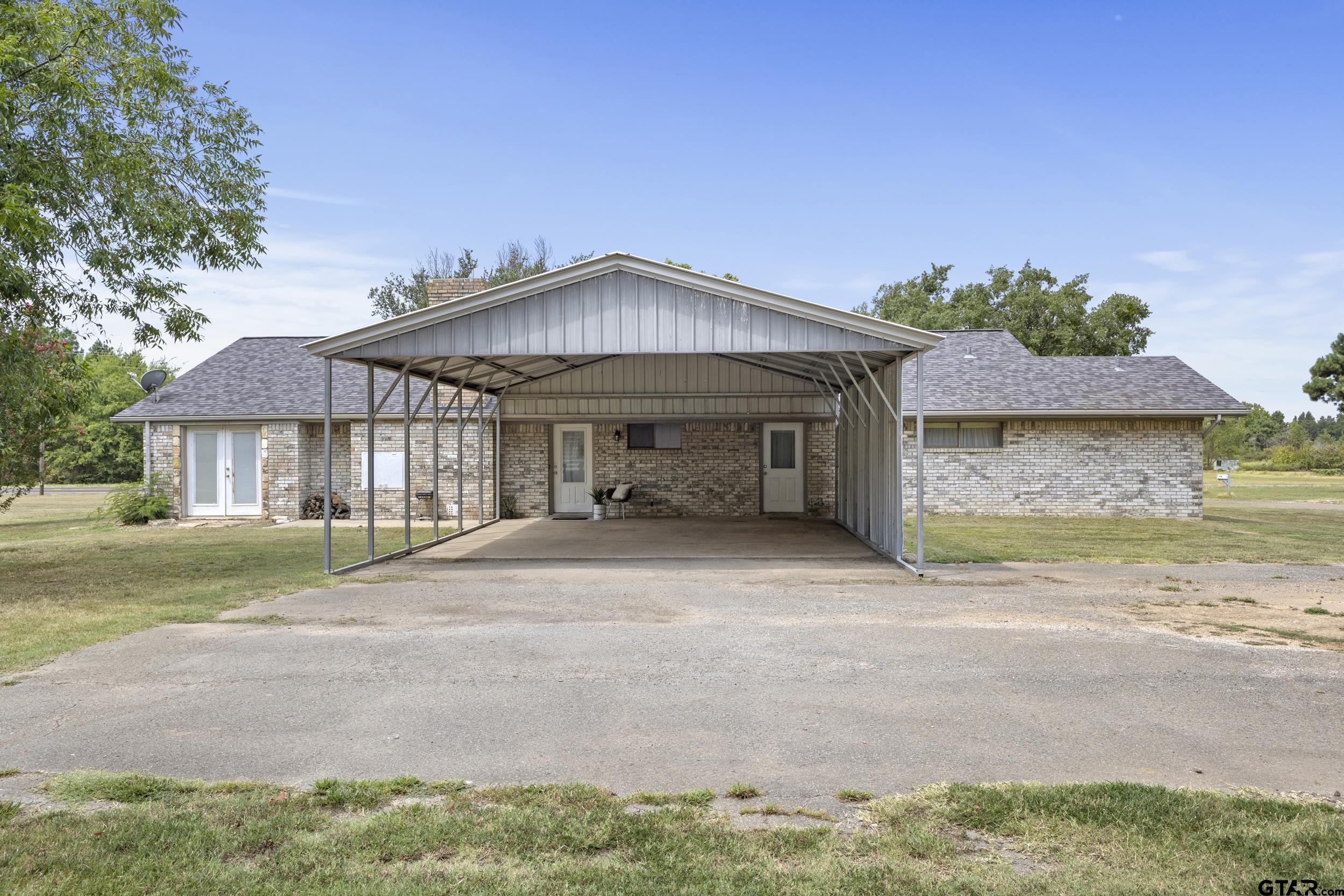 38 Quail Valley Road Mount Vernon, TX 75457 - Photo 7 of 46 a front view of a house with a yard