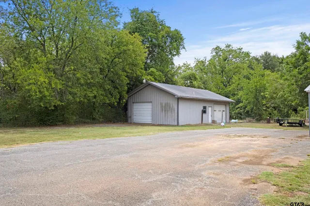 a house with trees in the background