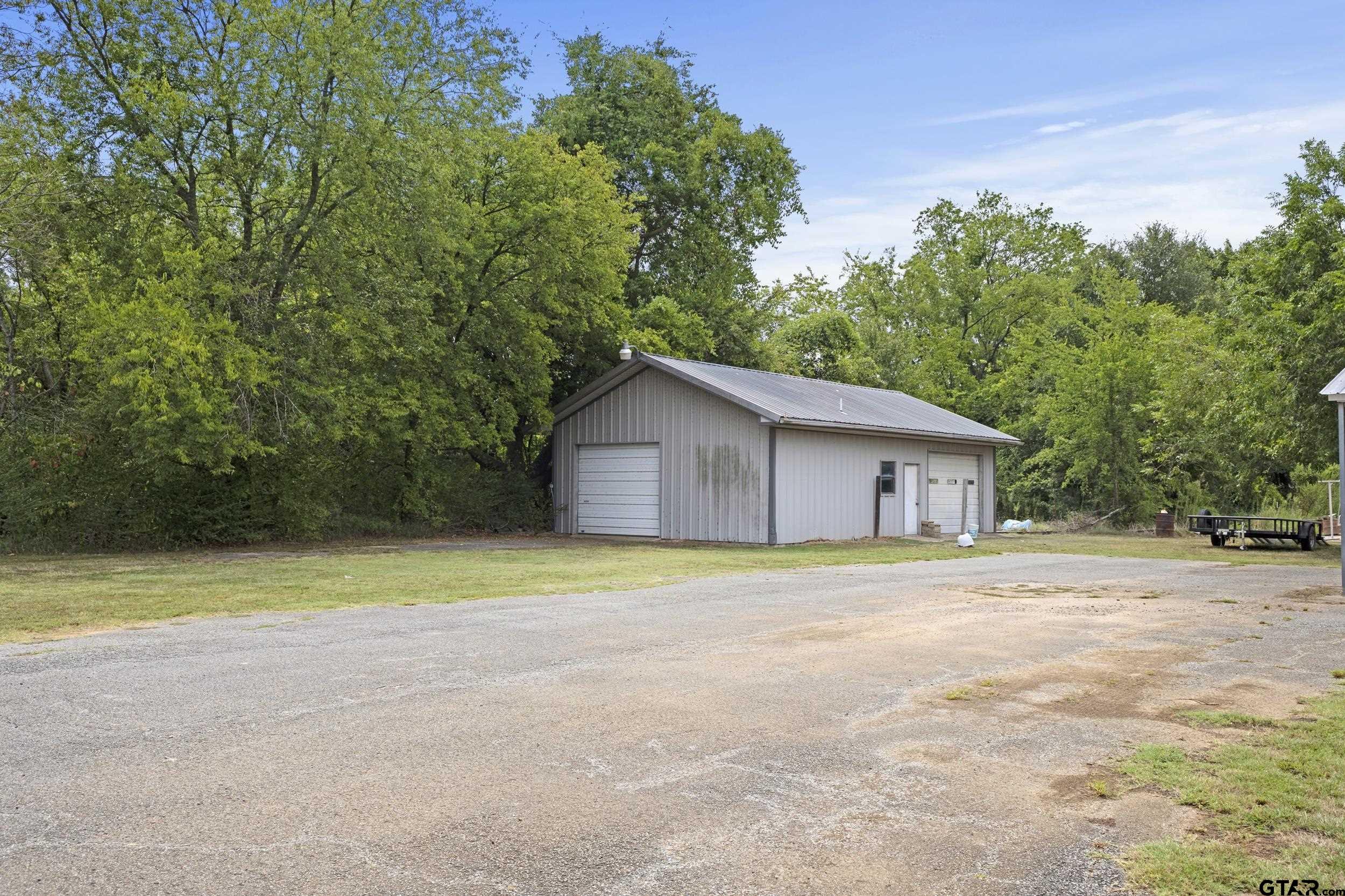 38 Quail Valley Road Mount Vernon, TX 75457 - Photo 10 of 46 a house with trees in the background