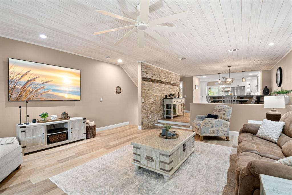 529 Sandy Hook Road Treasure Island, FL 33706 - Photo 8 of 55 a living room with furniture and a flat screen tv
