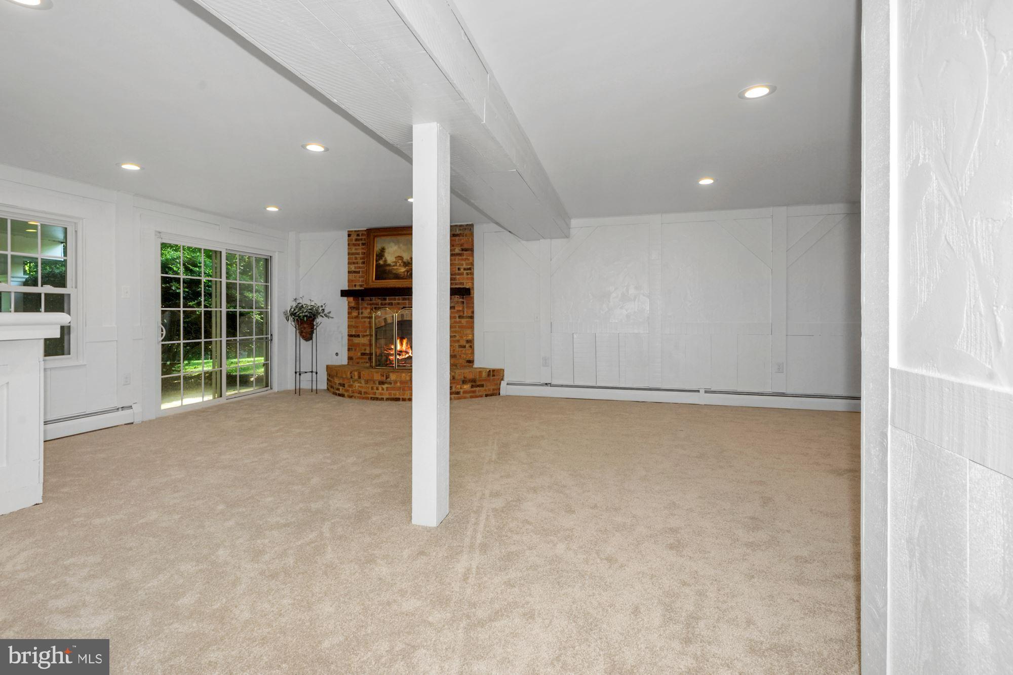 2741 Hill Road Vienna, VA 22181 - Photo 48 of 63 rec Rm w/ FP and door to rear yard