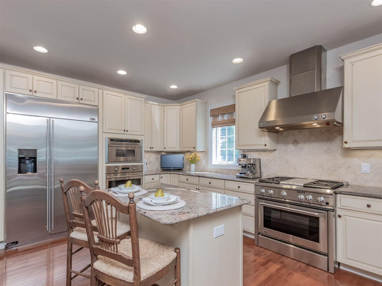 4717 Haleytree Court Raleigh, NC 27606 - Photo 10 of 30 Upgraded professional stainless steel appliances! Upgraded granite! 48" counter depth built in refrigerator! Wall oven and microwave with convection. Tons of cabinets and a tier 5 upgrade! Walk in pantry too! Kitchen
