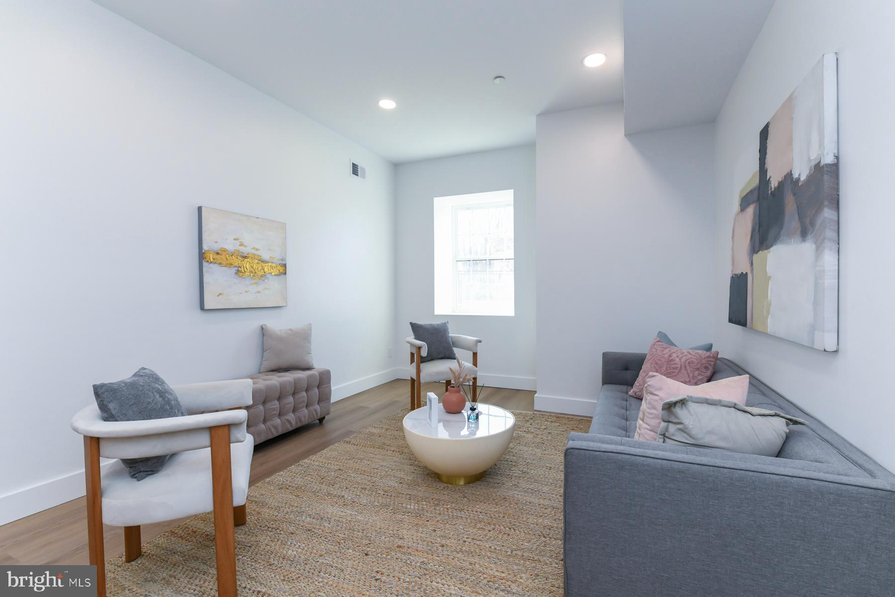 100 Aura Road, Unit 110 Clayton, NJ 08312 - Photo 11 of 21 a living room with furniture and a wooden floor